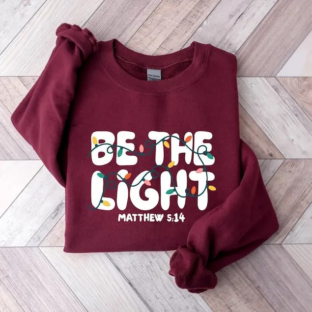 Be The Light Sweatshirt, Religious Christmas hoodie, Christian Holiday Sweater, Faith Based Gift, Christmas Gifted, Festive Apparel T-shirt, sweater and Hoodie