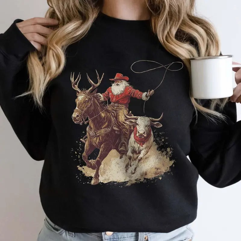 Cowboy Santa Western Roping Christmas Sweatshirt, Country Christmas Shirt, Cowgirl Gift Wrangling Santa, Unisex Long...