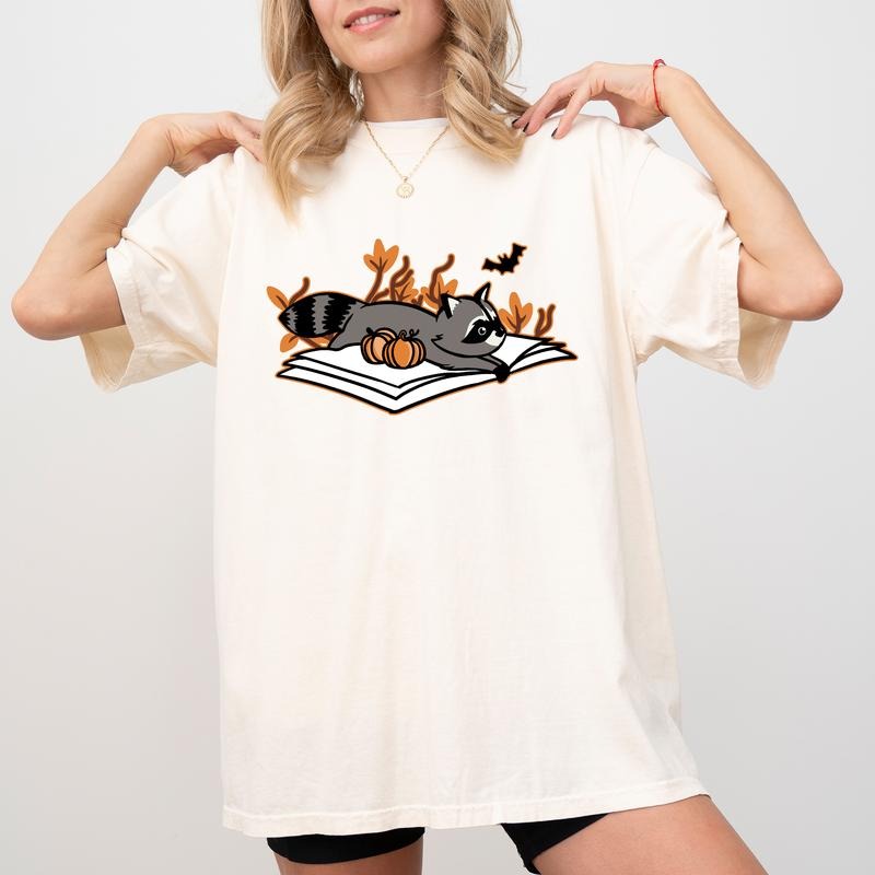 Fall Vibes Shirt, Raccoon Lover Graphic Printed Tee, Book Lover Unhinged Shirt, Cute Raccoon Fall Shirt, Trash Reader Tee, Born To Read Autumn Outfits, Comfy Fabric Graphic Tee, Women's Tops, Womenswear, Cotton Fabric Relaxed Fit Chic Style
