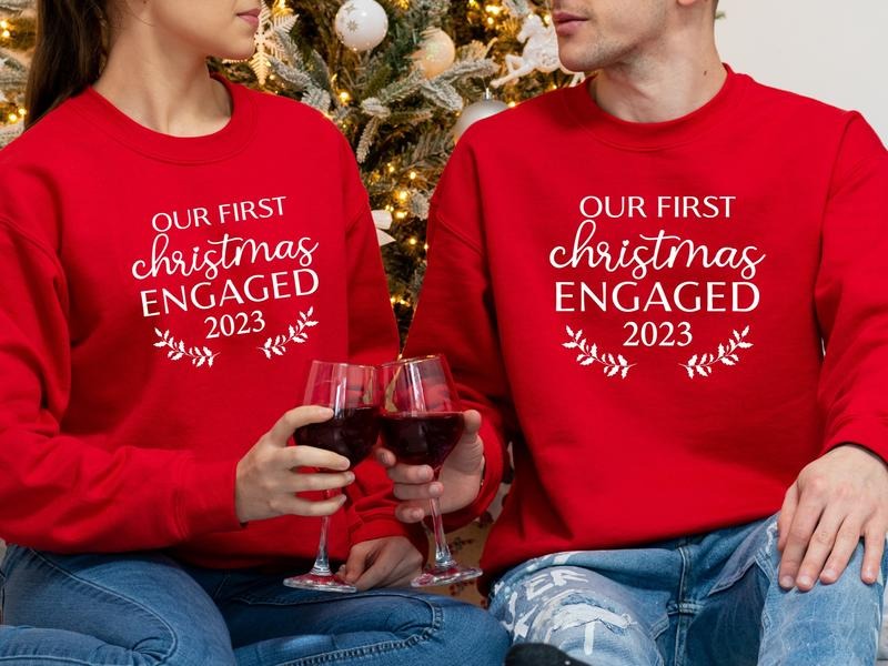 Our First Christmas Engaged 2023 Sweatshirt, Matching New Engaged Couple Xmas Hoodie, Engagement Gift Holiday Sweater,...