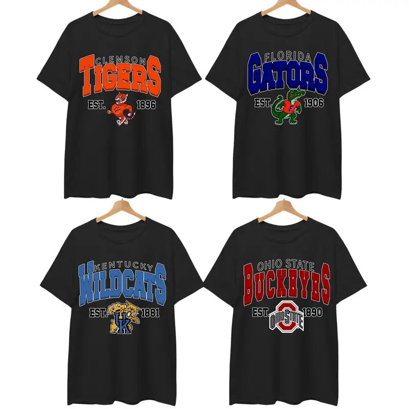 Retro College All Team Graphic Black T-Shirt, Classic University Mascot Print, 90s-Inspired Campus Spiritwear for Sports Fans, Students & Alumni, Gameday Ready Look