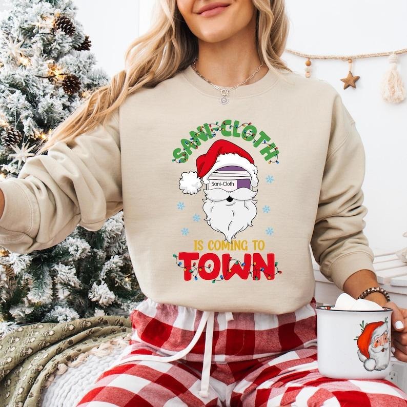 Sani Cloth Is Coming To Town Sweatshirt, Santa Nurse Christmas T-shirt, ICU ER Nurse Shirt, Xmas Nurse Life Tee, RN Nurse...