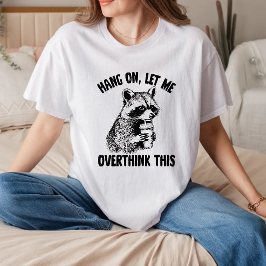 Funny Raccoon Shirt – “Hang On Let Me Overthink This” Graphic Tee Hoodie, Sweatshirt | InkThreadWorks.com (Image 1)