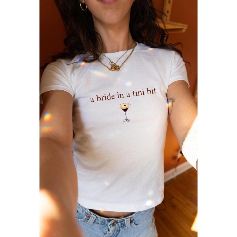 A Bride In A Tini Bit Baby Tee, Espresso Martini Themed Bachelorette Party Espresso Martini Bride Baby Tee, Espresso...
