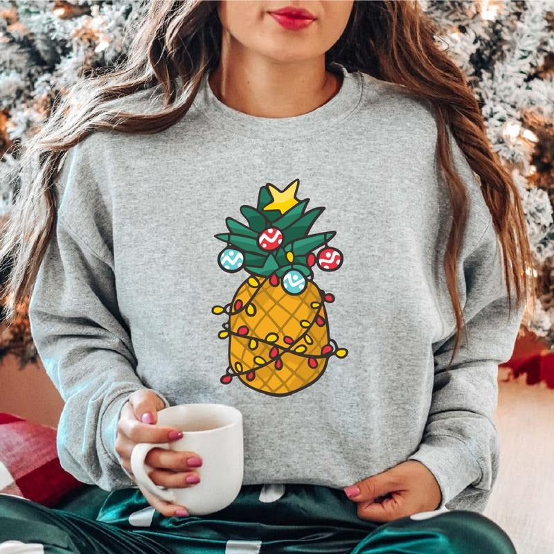 Christmas Pineapple Sweatshirt, Christmas Light Hoodie, Xmas Celebration Sweater, Funny Fruit Sweater, Unisex Pineapple...