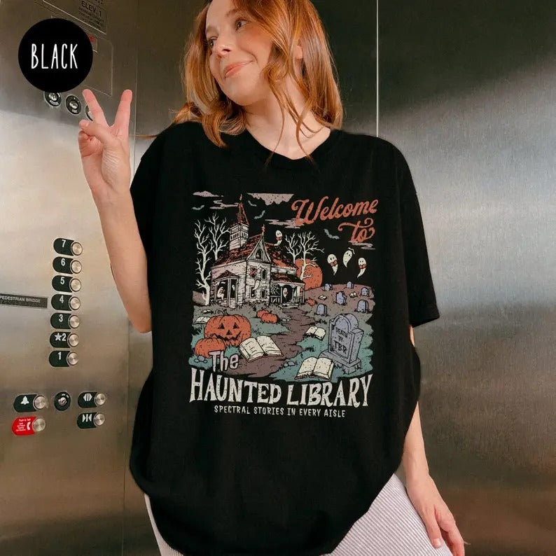Haunted Library Shirt for Book Lover, Funny Halloween Librarian Graphic Tee, Bookish Spooky Crewneck Reading Ghost T-Shirt Fall Cotton Top