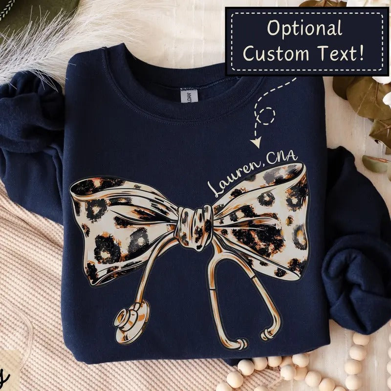 Personalizable Coquette Nurse Shirt, Custom Name Leopard Print Stethoscope Bow T-Shirt, Gift for Nurse, Nurse Graduation,...
