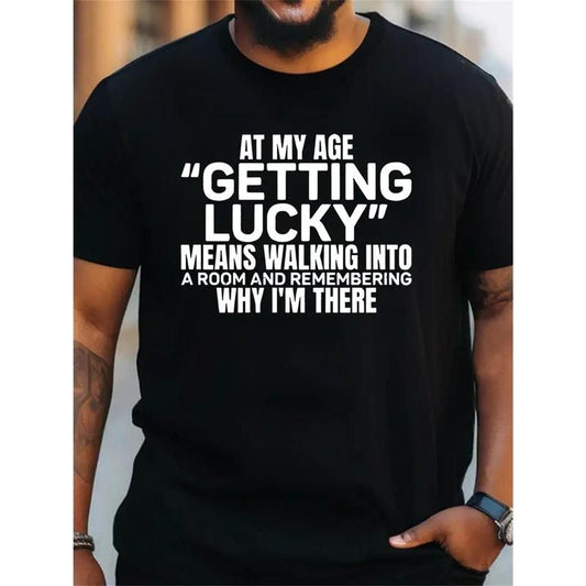 Plus-Size Men's "At My Age Getting Lucky" Graphic T-Shirt - Soft Cotton, Round Neck, Comfortable Fit, Ideal for Casual Wear & Outdoor Activities, Black with White Text Design, Retro T Shirt, Made in USA