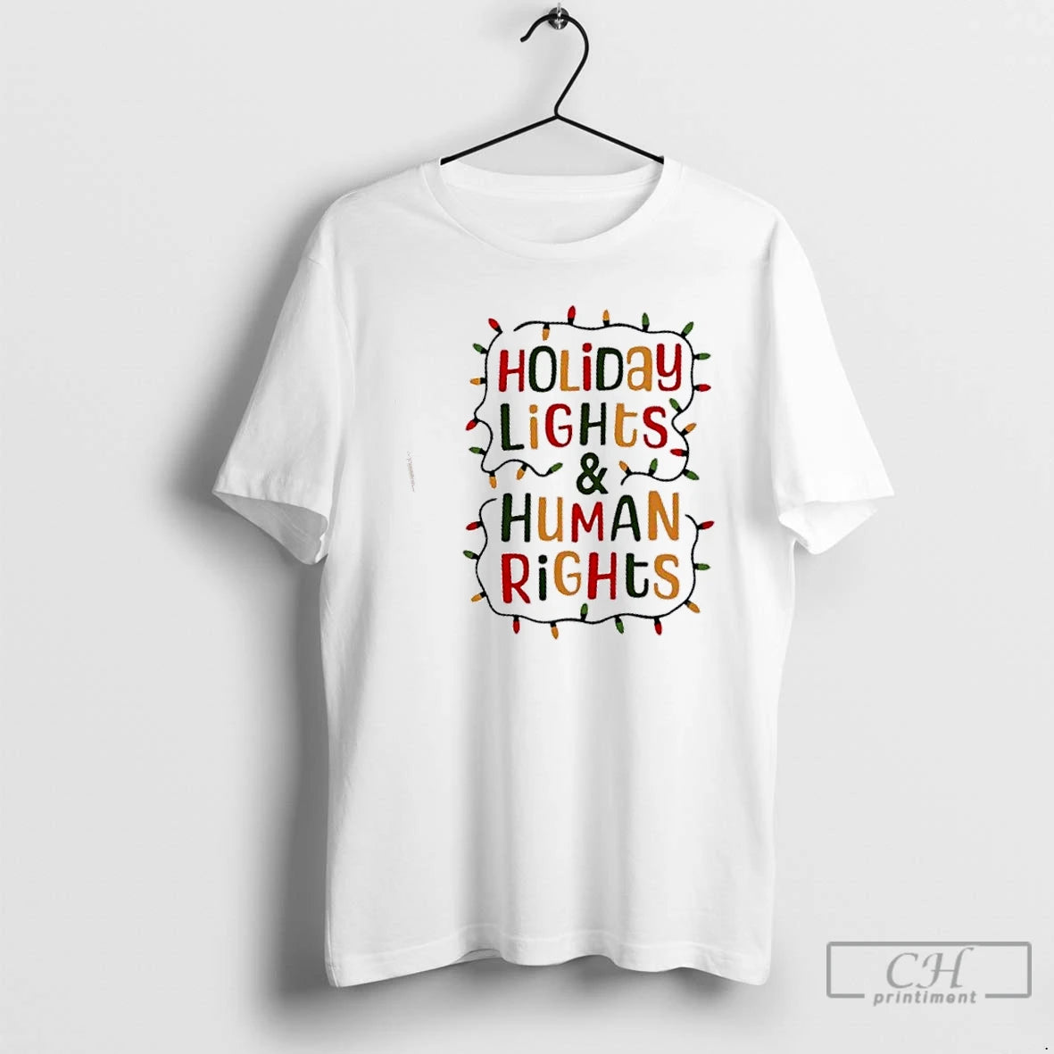 Premium Holiday Lights And Human Rights Christmas Gift T-Shirts, Hoodie, Sweatshirt | InkThreadWorks.com