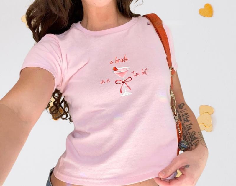 [Sale up to 60%] A Bride in A Tini Bit Bachelorette Baby Tee, Y2k Trending Bachelorette Party Baby Tee, Bride to Be...